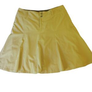Athleta tan A line tennis / golf skort with zipper closure